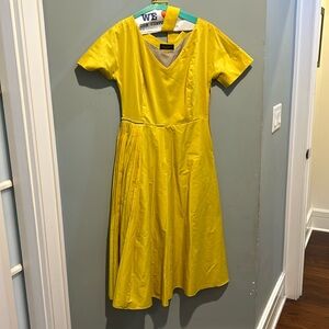 Below the knee, yellow dress shorts sleeve, pleaded skirt, belted, side zipper